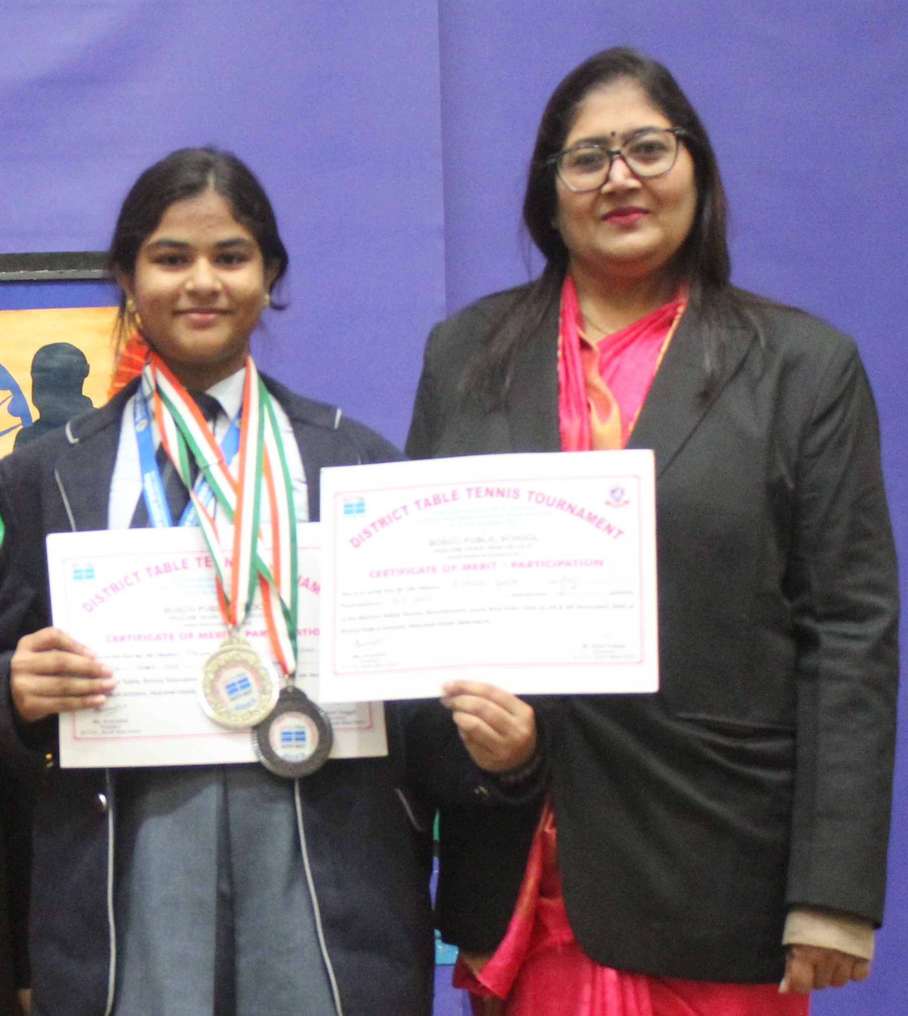 Table Tennis Tournament participant with teacher.